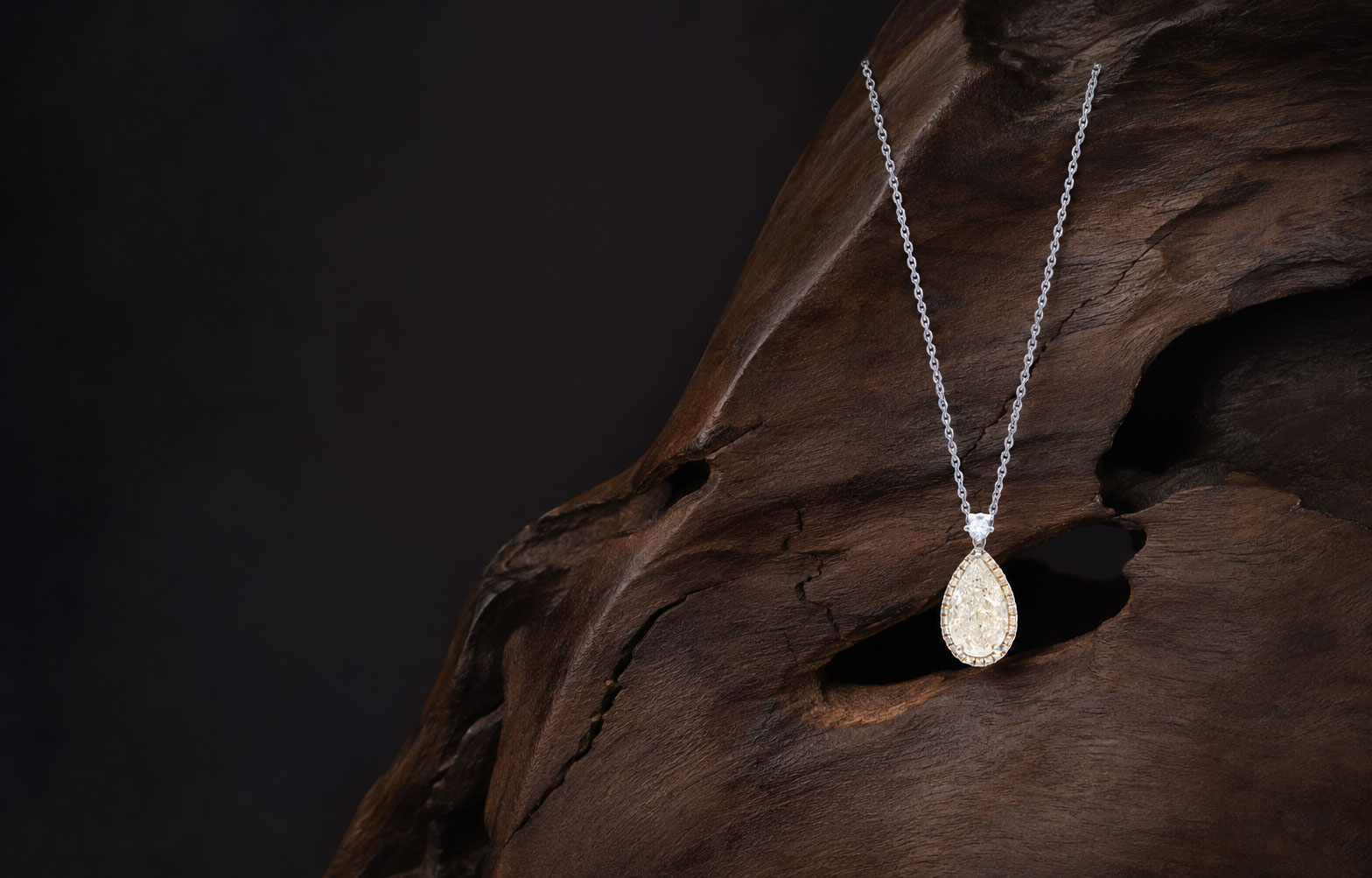 Jeweller setting a stone on the bench